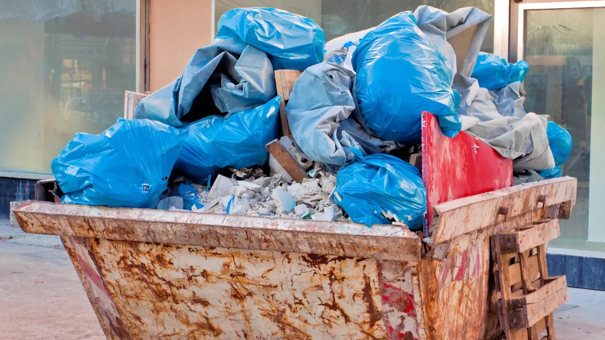 a full dumpster after a house clean out a full dumpster after a house clean out