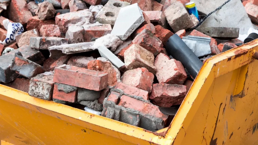 bricks in a commercial dumpster rental at a construction project