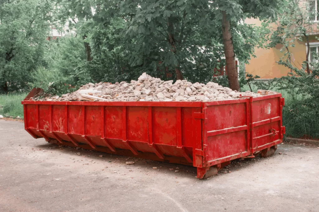 concrete waste in a dumpster