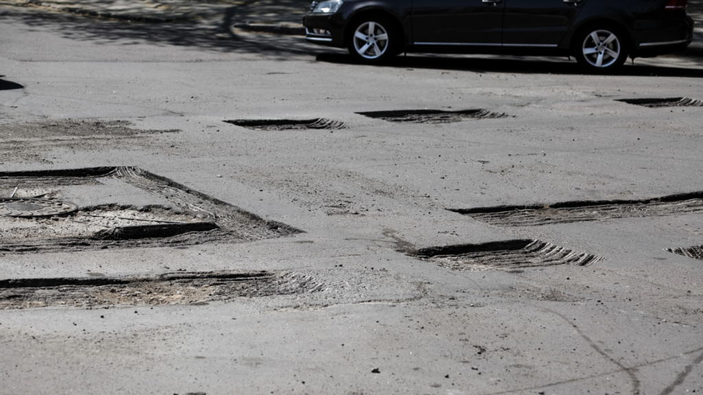 driveway damaged by a dumpster