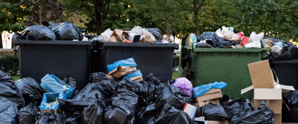 dumpsters overflowing with trash